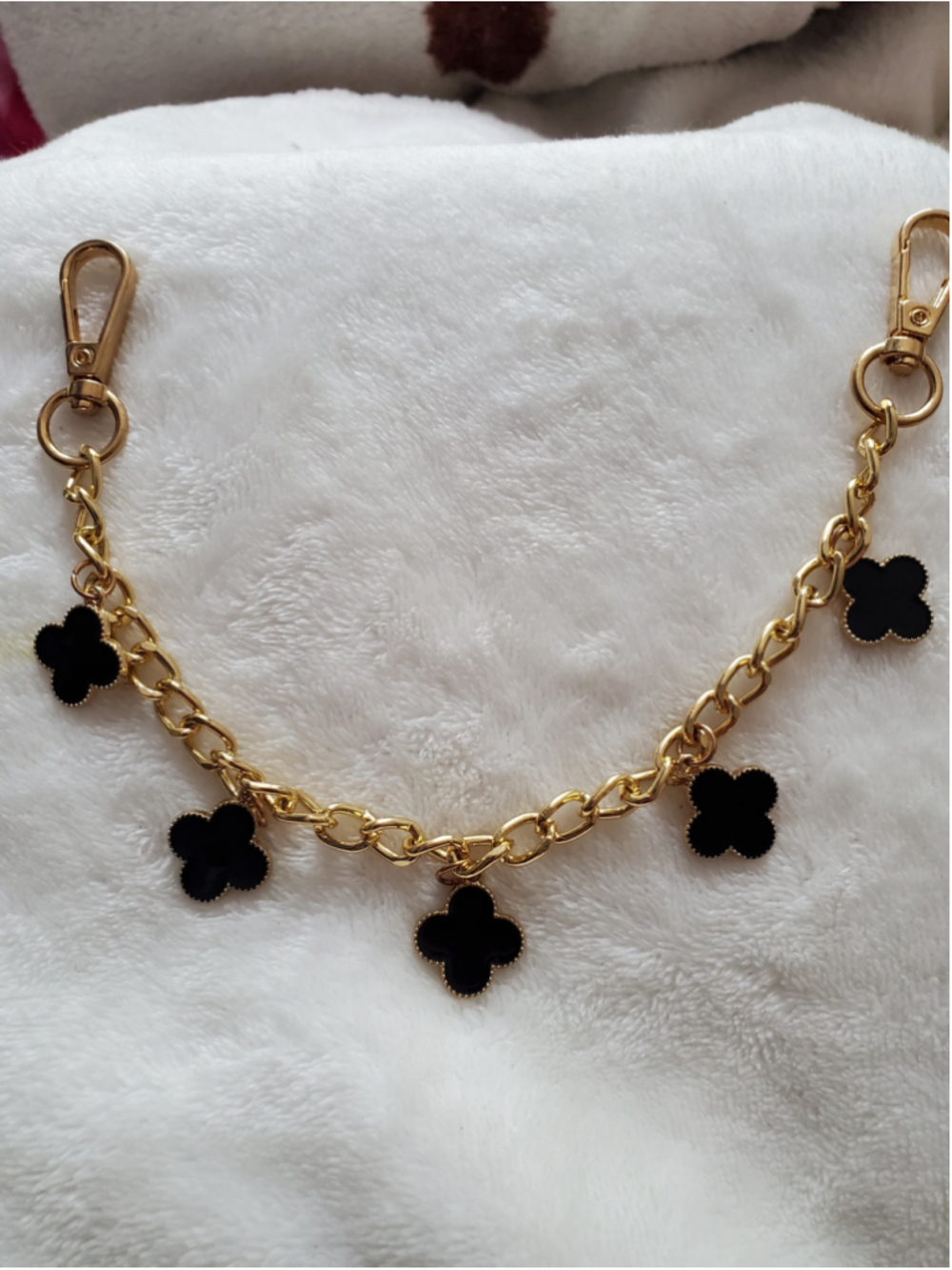 Bag or wallet chain with black and gold charms